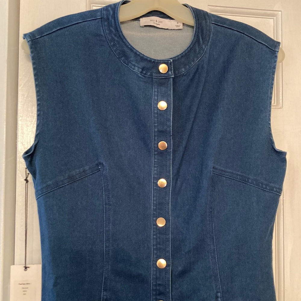 Designer stretchy sleeveless jean dress with fringed bottom and gold hardware